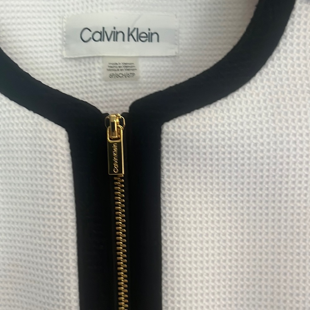 White suit jacket with black trim and gold accents. (Matching skirt nwt avail)